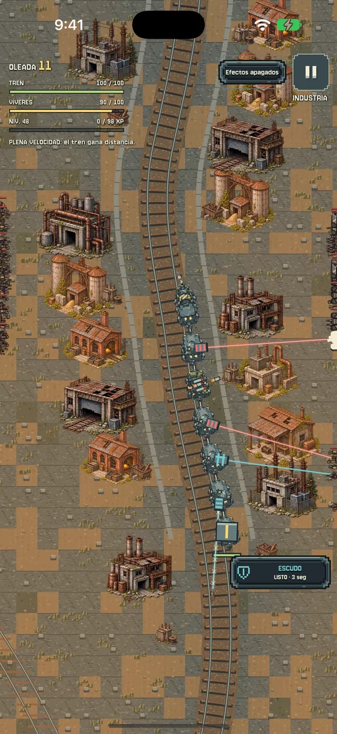 El tren avanza entre edificios industriales.