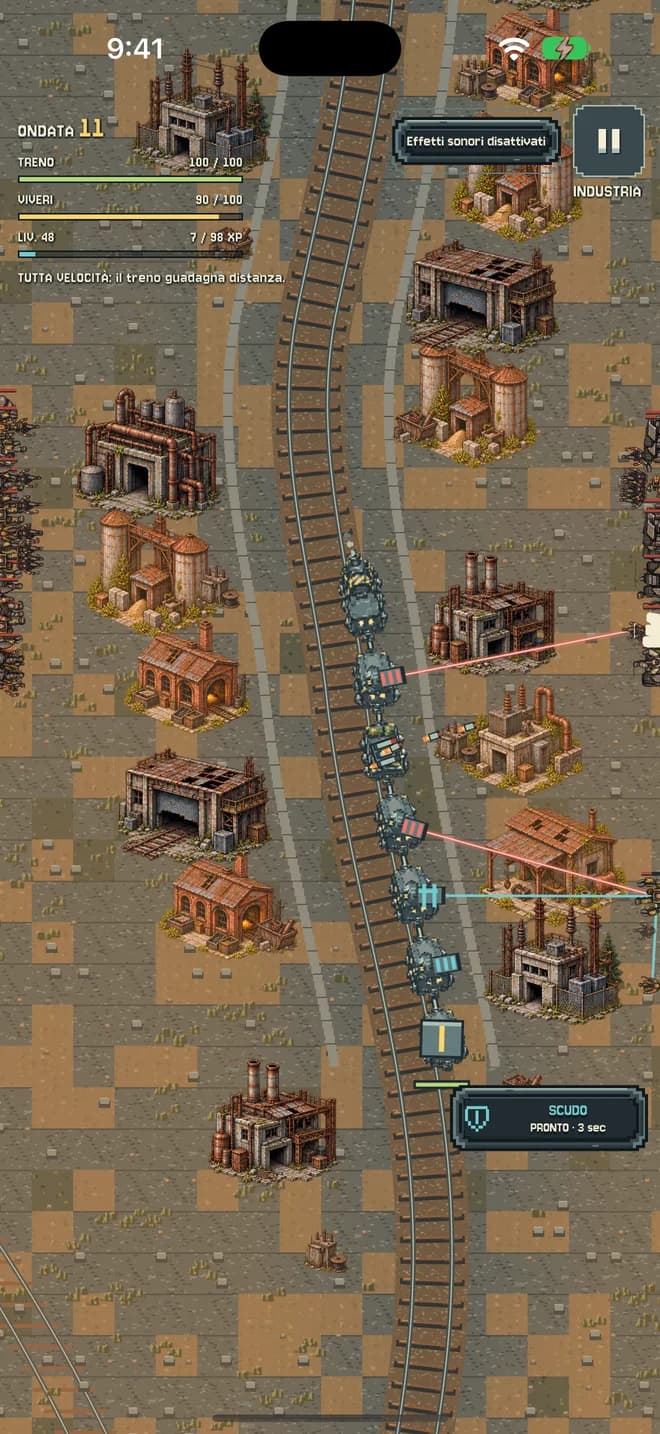 Il treno avanza tra edifici industriali.